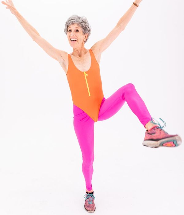 A man smiling and feeling energetic after a home workout.